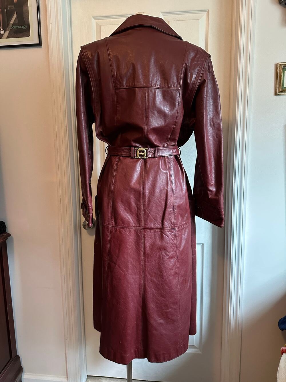 Vintage Etienne Aigner leather trench with brass accent.